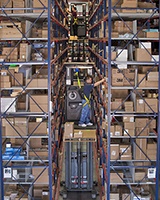 Raymond 5000 Series Orderpicker in warehouse aisle