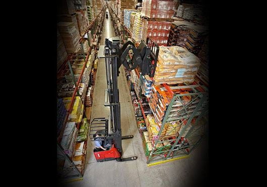 Raymond deep reach forklift in narrow aisle warehouse