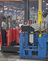 Raymond Sideloader steel handling forklift in manufacturing plant